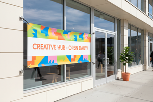 Vinyl banner hung on a clean bright storefront in natural daylight